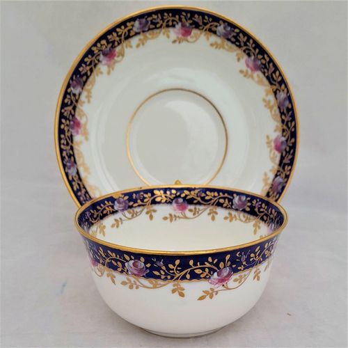 back image - Antique porcelain tea cup & saucer hand painted blue rim & swagged pink roses by W. Lambert 1915 - Larcombe King St Derby on a Bishop & Stonier Blank
