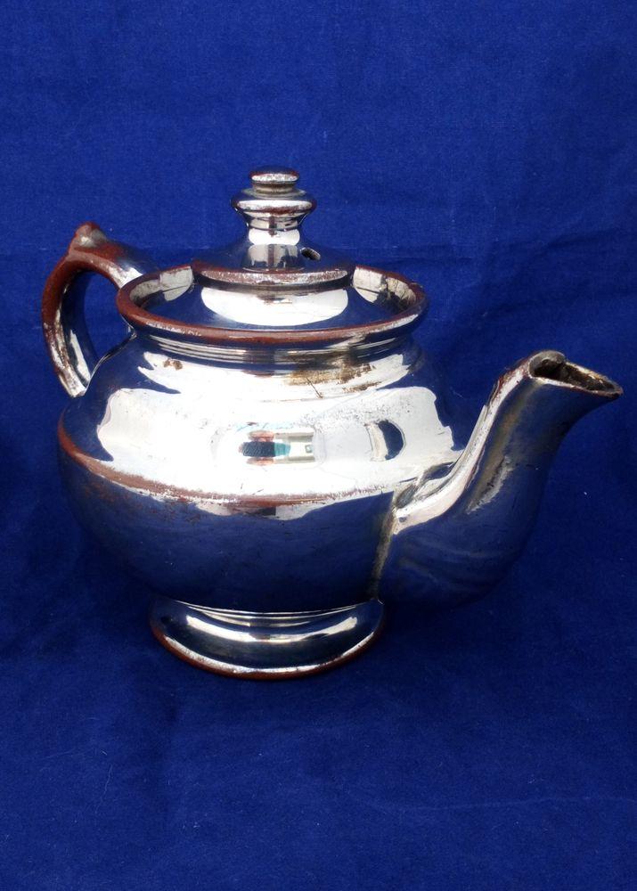 Victorian antique platinum lustre teapot with a shouldered round body on a pedestal foot and with a low collar, it is bachelor sized circa 1840