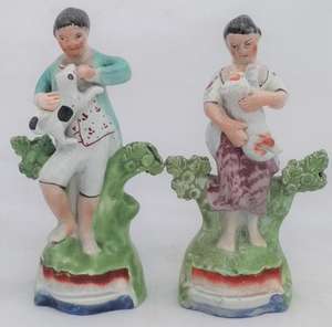 Antique Pair of Enamelled Pearlware Sherratt Style Bocage Figurines of Shepherd with Dog and Shepherdess with lamb circa 1820