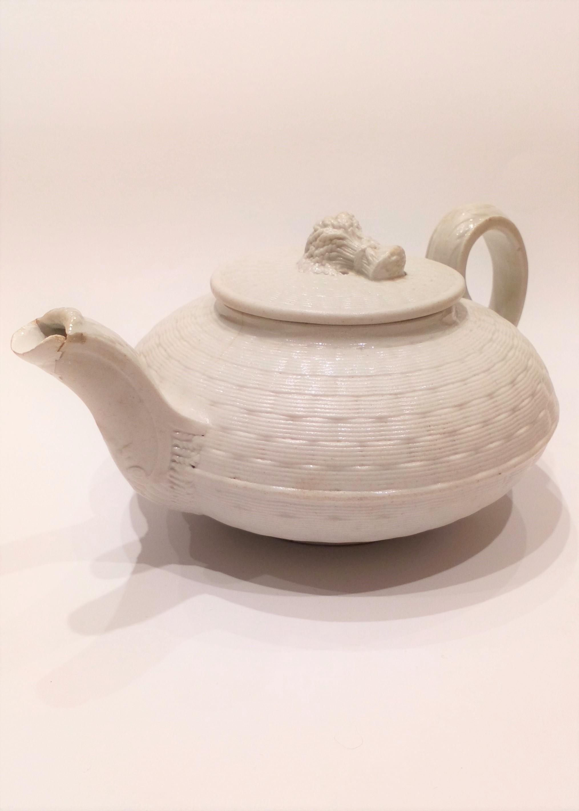 An antique Wedgwood white salt glazed stoneware teapot basket weave pattern with Wheat Sheaf finial circa 1825