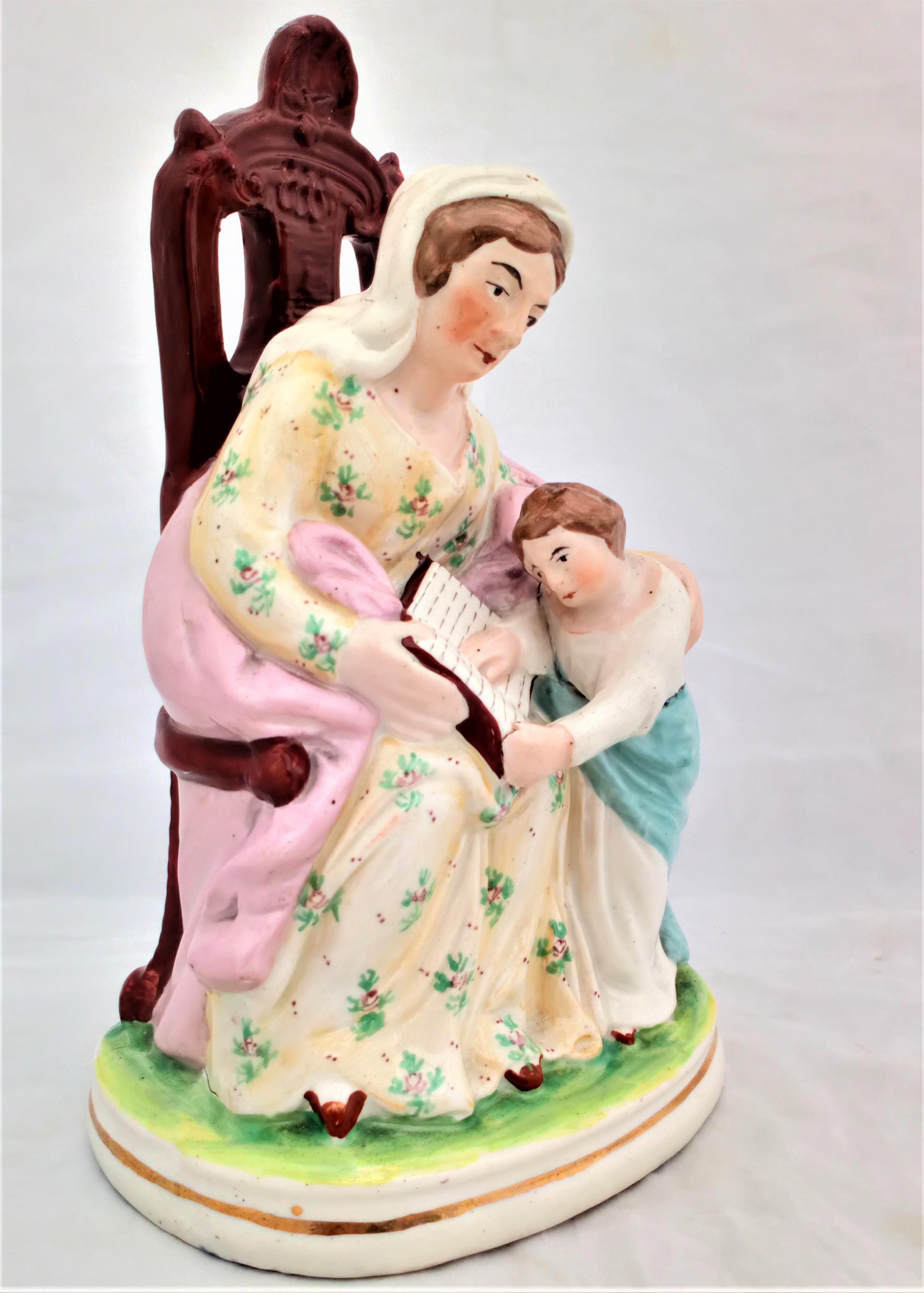 Antique Staffordshire Figurine The seated Prudent Mother and Child Reading circa 1850