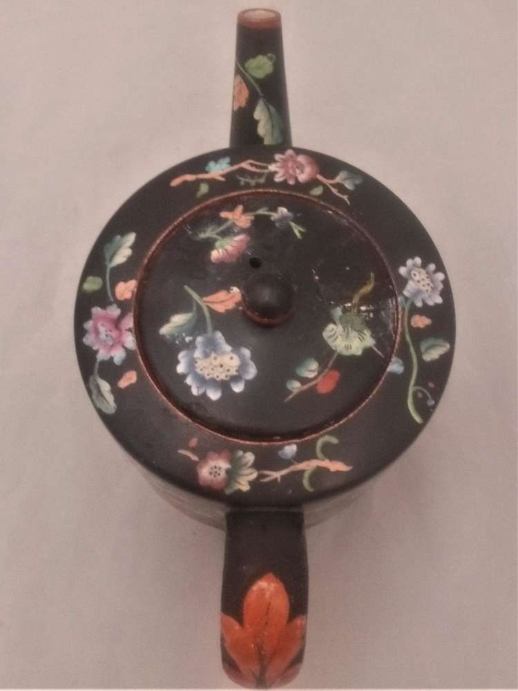 Antique Davenport transferware cylindrical teapot  decorated with the Chrysanthemum Floral Spray pattern on a black ground circa 1860