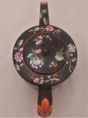 Antique Davenport transferware cylindrical teapot  decorated with the Chrysanthemum Floral Spray pattern on a black ground circa 1860
