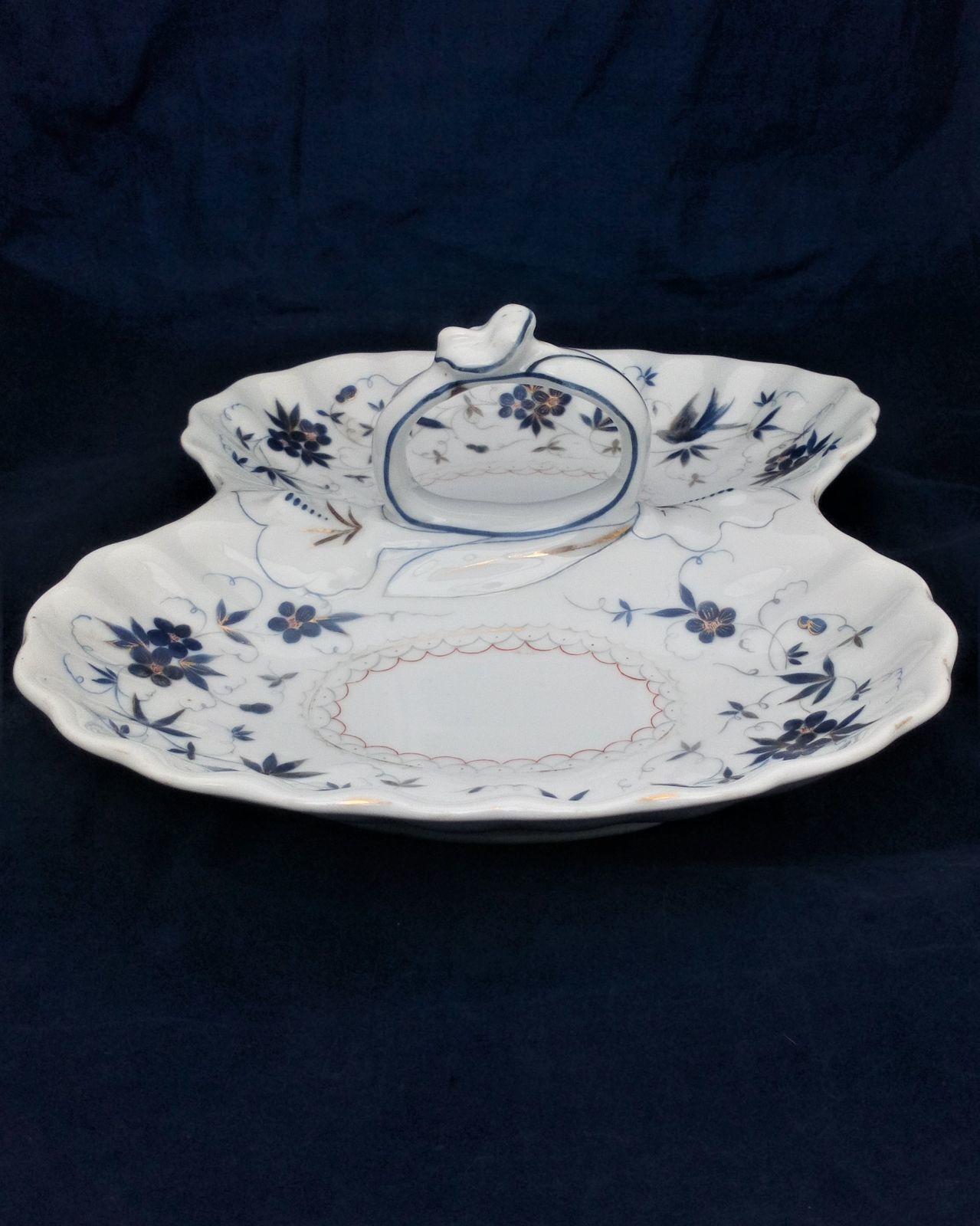 Antique German porcelain hors d'ouevres dish with loop handle decorted with blue flowrs and birds with gided highlights. Marked on the base KPM for Krister Porzellan-Manufaktur of Waldenburg circa 1860.