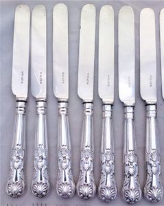 An antique set of twelve place setting of Elkington silver plated cutlery with Kings pattern handles. The round nosed bladed knives and the four pronged forks are each marked with the Elkington and Co marks and the date code W for 1882.