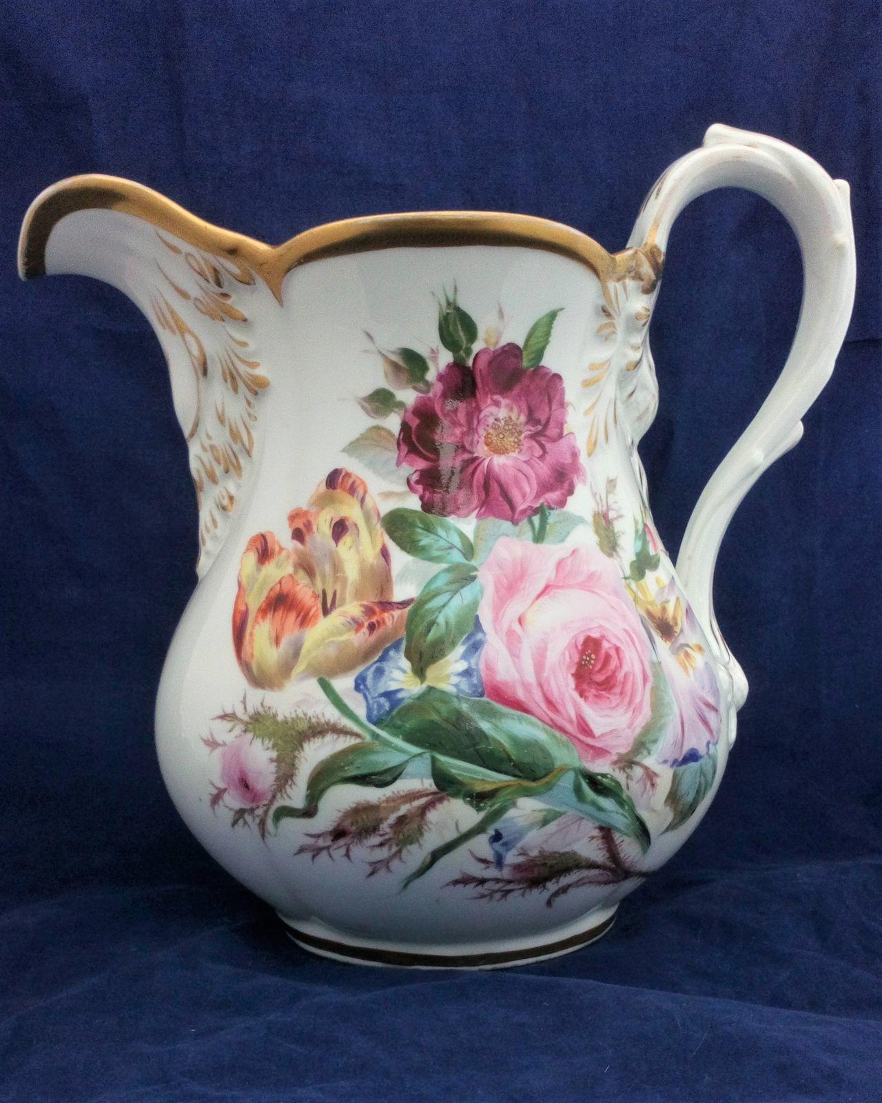A large antique five pint capacity porcelain jug made by John Rose of Coalport probably painted by William Billingsley with Flowers circa 1825. It is 10 inches high.