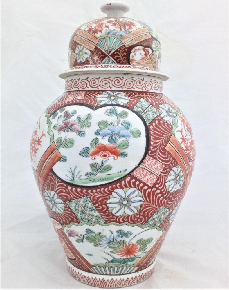 A large antique Japanese Hizen porcelain vase and cover marked Zoshuntei Saiho. Decorated in hand painted enamels with two large Japanese folding fans each painted with a colourful Asiatic Pheasant flying over a Japanese Acer.  This antique temple vase and cover dates from the mid 19th century circa 1860.