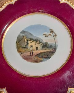 An antique Flight Barr and Barr Worcester Porcelain dessert plate hand painted with a landscape pattern titled Patterdale circa 1825.  The scene is after an oil painting exhibited in the RA in 1783 by Philip James de Loutherbourg  (1740-1812) of a horse and cart outside a cottage in Patterdale, Westmorland. his very fine English porcelain plate carries the impressed mark on the base of a crowned FBB for  Flight,Barr and Barr who operated from 1813 until 1840. The back also has the hand painted mark in puce " Flight Barr and Barr, Royal Porcelain Works, London House No,1 Coventry Street".