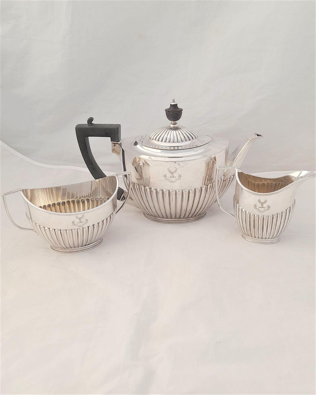 An antique Edwardian silver plated Regent Plate tea service three piece in the new oval shape each item engraved  with the crest for Heriot circa 1905 by the Goldsmiths and Silversmiths Company of 112 Regent Street London.