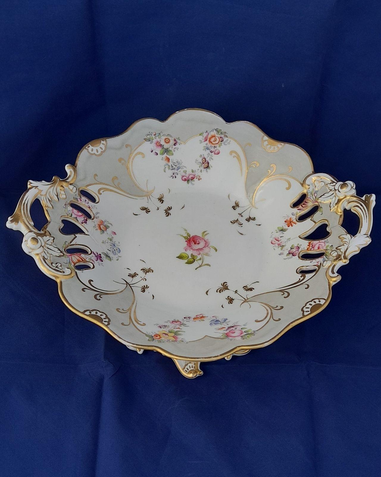 an antique large John Ridgway and Co porcelain comport shaped and pierced in a rococo revival style printed and hand painted in pattern number 5836 circa 1840