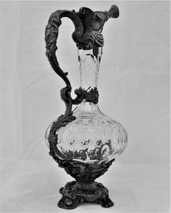 French ornate gothic scroll white metal mounted cut glass claret jug antique circa 1870 - shaft & globe shape decorated with thumb cuts & faceted neck 13 inches 1 1/2 pint capacity.