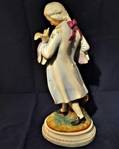 An antique French Old Paris enamelled bisque porcelain figurine young man with a dove on an oval faux marble base circa 1880 - 37 cm high - 2.58 Kg Probably Chantilly