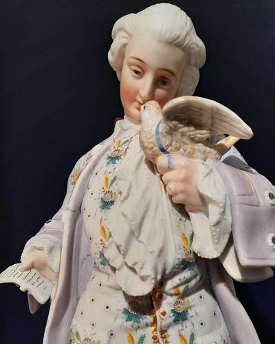 An antique French Old Paris enamelled bisque porcelain figurine young man with a dove on an oval faux marble base circa 1880 - 37 cm high - 2.58 Kg Probably Chantilly