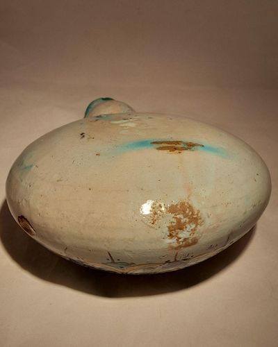 Moroccan tin glazed earthenware or faience pilgrim water flask antique 19th century hand painted with polychrome Arabesque foliate geometric pattern  727 grammes  9 inches long 6.5 inches wide  3 5/8 inches deep