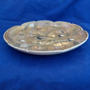 side left view - Japanese Satsuma Pottery Low relief Moulded Plate Painted Immortals or Lucky Gods with Halos marked Satsuma & Shimazu mon - Antique Meiji circa 1900