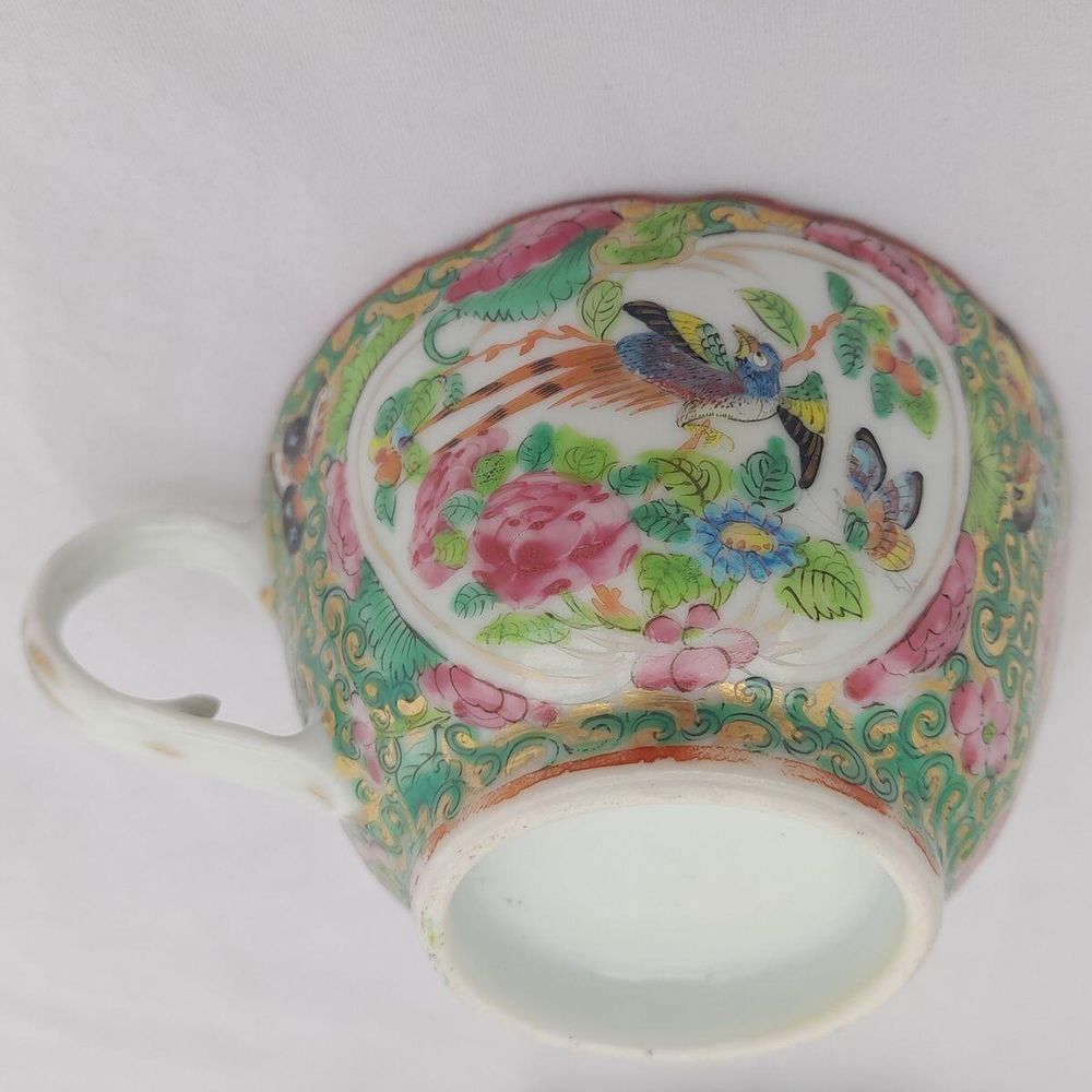 Close up of the bird and butterfly cartouche on the cup
