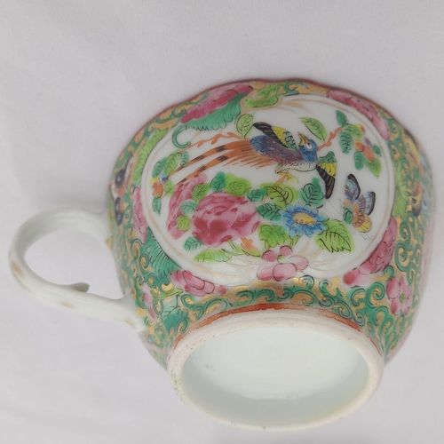 Close up of the bird and butterfly cartouche on the cup