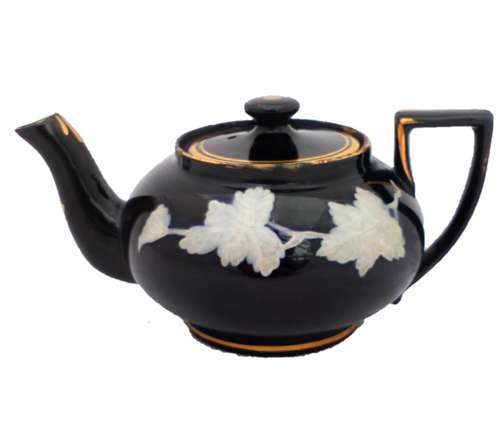 Victorian black glazed teapot with white enamelled vine leaves and stems antique circa 1850