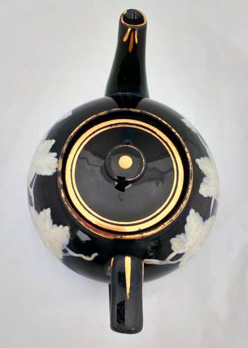Victorian black glazed teapot with white enamelled vine leaves and stems antique circa 1850