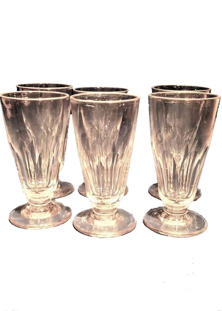 Set of six antique faceted trumpet bowled aperitif glasses with blade knop rudimentary stem and low moulded foot French 19th C
