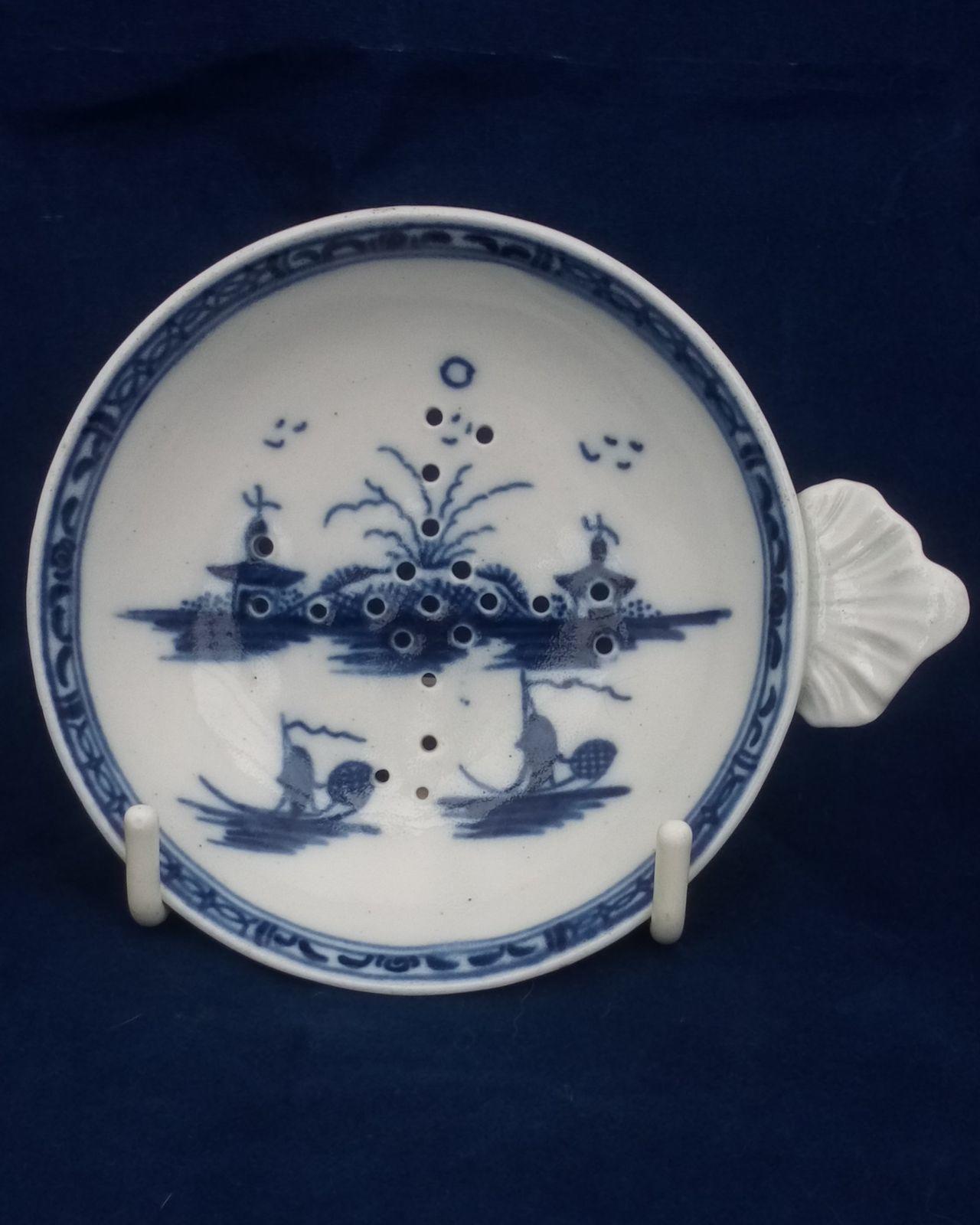 Rare shaped antique Caughley miniature or toy porcelain blue and white hand painted Island pattern Milsey or Strainer circa 1780 with shell shaped handle and Buddhist swastika peace pattern piercing.