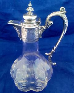 A very attractive antique Aesthetic Movement silver plated mounted cut glass lobed claret jug decorated with cut stylised daisies circa 1870.