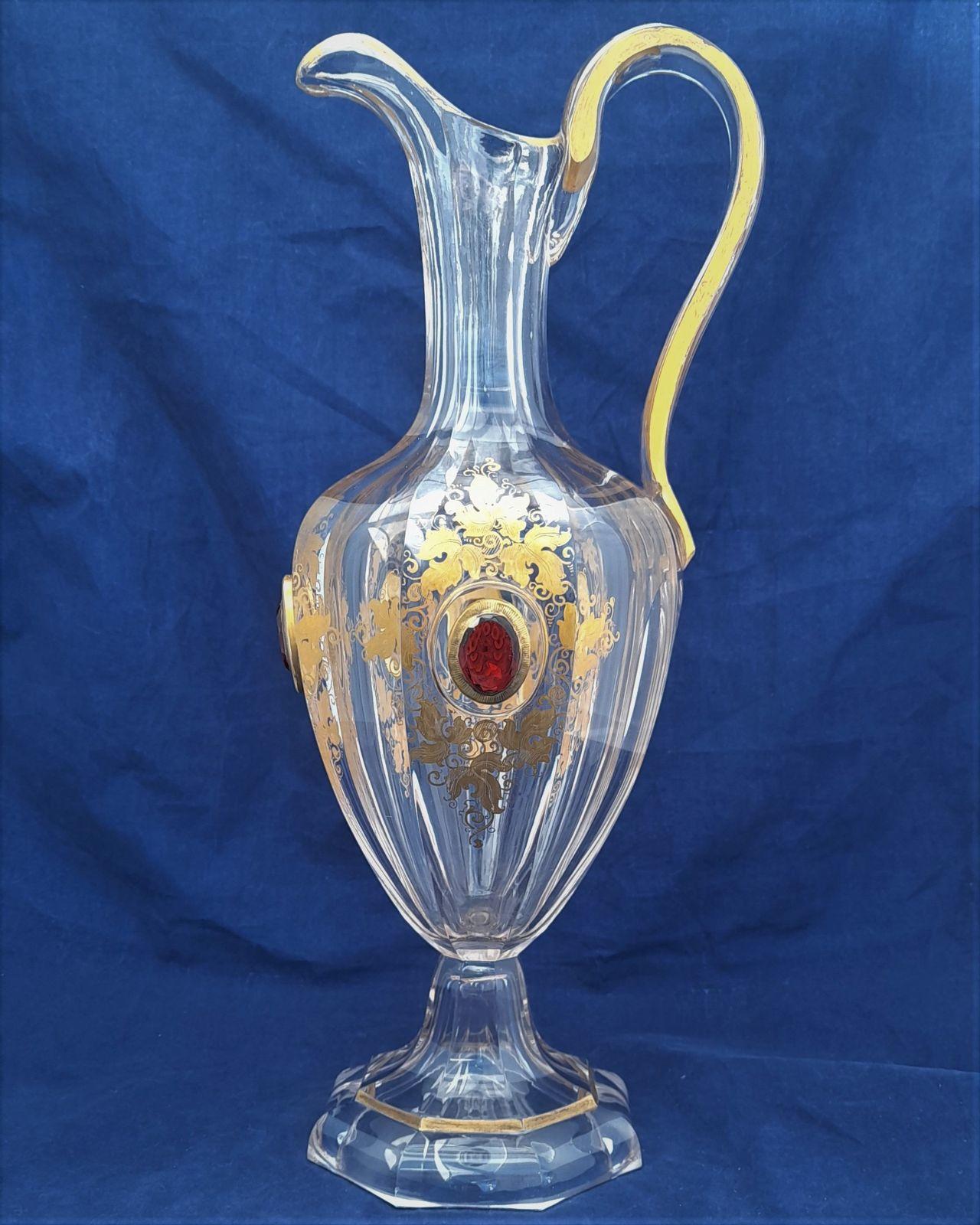 Antique Bohemian ruby red jewelled and gilded clear cut glass pedestal footed hexagonal oviform water jug circa 1870 34.5 cm high 12.8 cm diameter weighs 1246 grammes unpacked 900 ml capacity