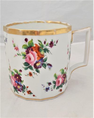 An antique English porcelain Thomas Rose Coalport Porcelain fourteen sided faceted pint sized mug or tankard with hand painted flowers and square or French handle circa 1805