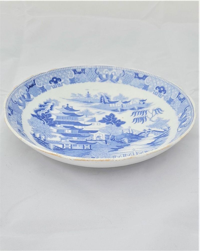 An antique Miles Mason type porcelain saucer dish transfer printed in blue and white in the Two Temples Broseley pattern circa 1810