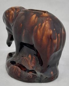 An antique novelty pottery elephant money box with a Rockingham type brown treacle glaze dates to the early 19th century - piggy bank in the form of a Jumbo elephant circa 1830 10. 3 cm high 12.6 cm long