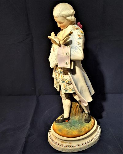 An antique French Old Paris enamelled bisque porcelain figurine young man with a dove on an oval faux marble base circa 1880 - 37 cm high - 2.58 Kg Probably Chantilly