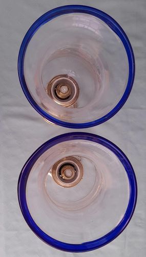 Pair of antique brass spring loaded hurricane candlesticks with grapevine etched glass shades with blue rim & cut glass prism lustre droppers 53 cm High 3.8 kg