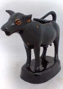 Staffordshire Jackfield Black Glazed Cow Creamer Gilded Decoration c 1860