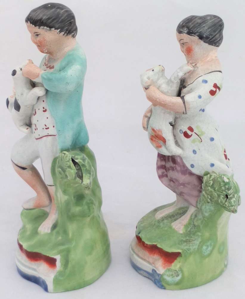 Antique Pair of Enamelled Pearlware Sherratt Style Bocage Figurines of Shepherd with Dog and Shepherdess with lamb circa 1820