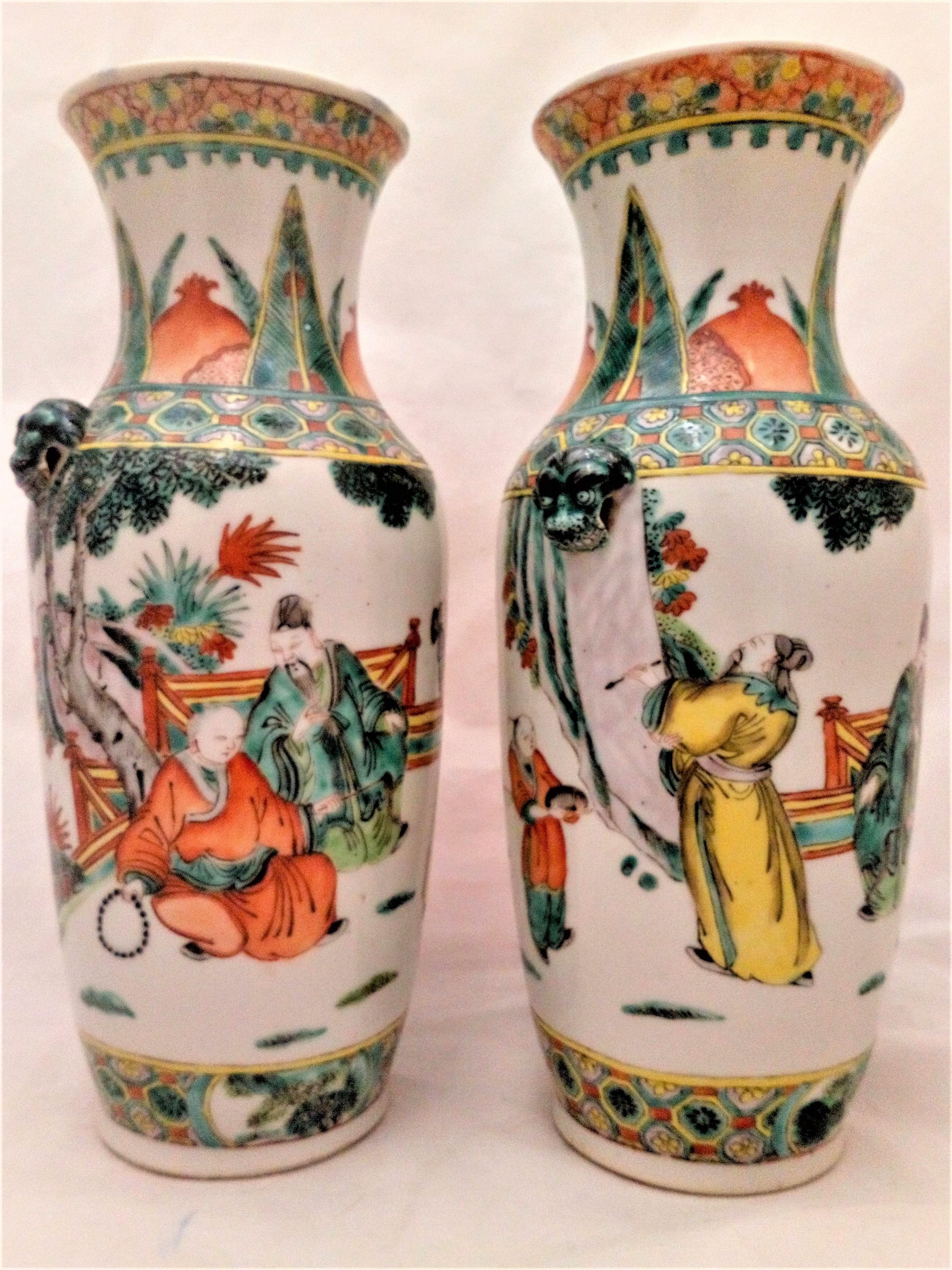 An antique pair of Chinese porcelain vases hand painted in the Famille Verte palette with Scholars and Emperor from the late Qing Dynasty 清代