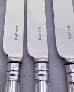 An antique set of twelve place setting of Elkington silver plated cutlery with Kings pattern handles. The round nosed bladed knives and the four pronged forks are each marked with the Elkington and Co marks and the date code W for 1882.