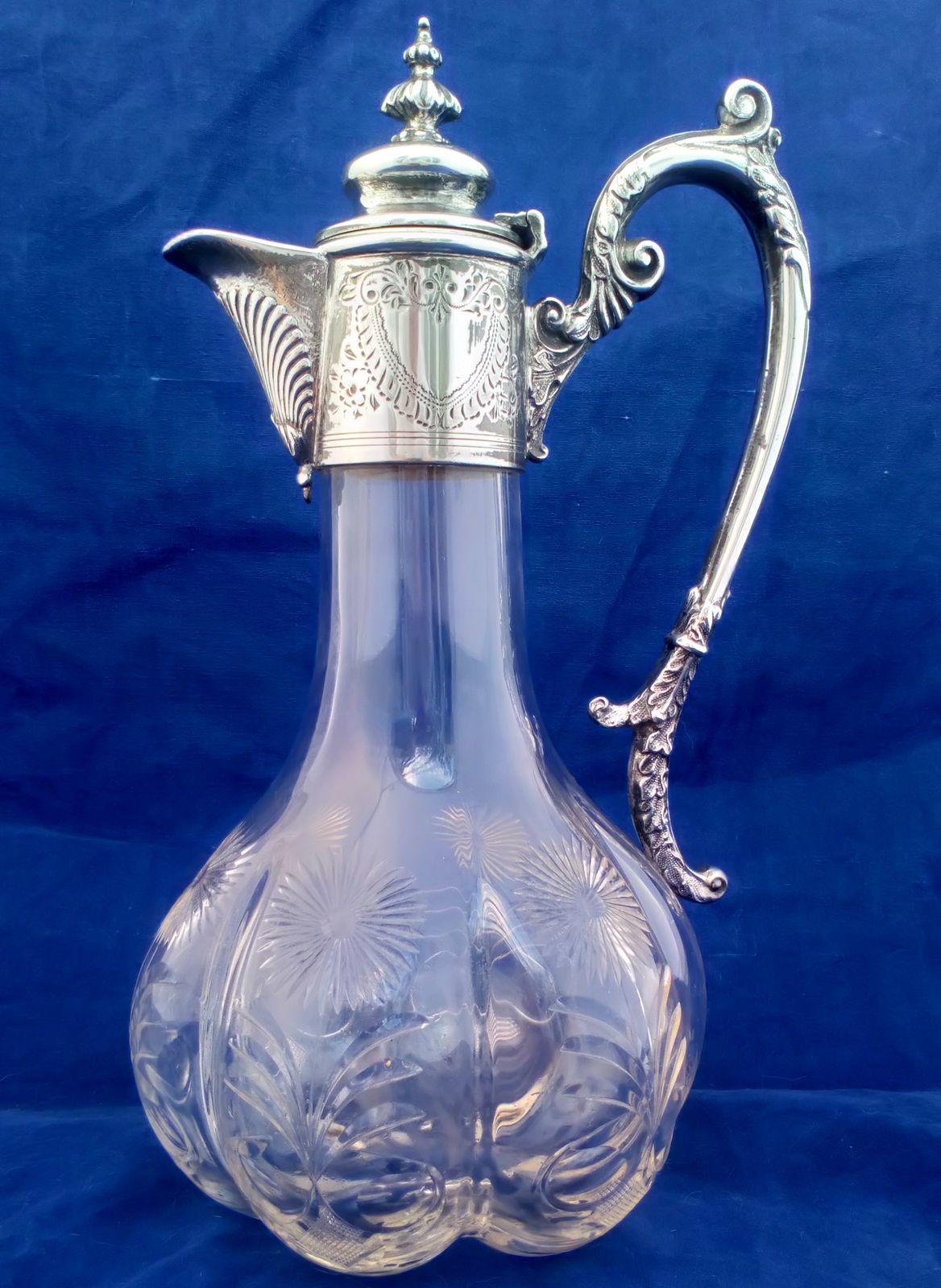 A very attractive antique Aesthetic Movement silver plated mounted cut glass lobed claret jug decorated with cut stylised daisies circa 1870.