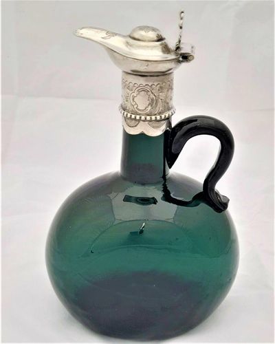 Antique Bristol green flagon decanter with white metal mounts antique circa 1870. Bocksbeutel