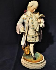An antique French Old Paris enamelled bisque porcelain figurine young man with a dove on an oval faux marble base circa 1880 - 37 cm high - 2.58 Kg Probably Chantilly