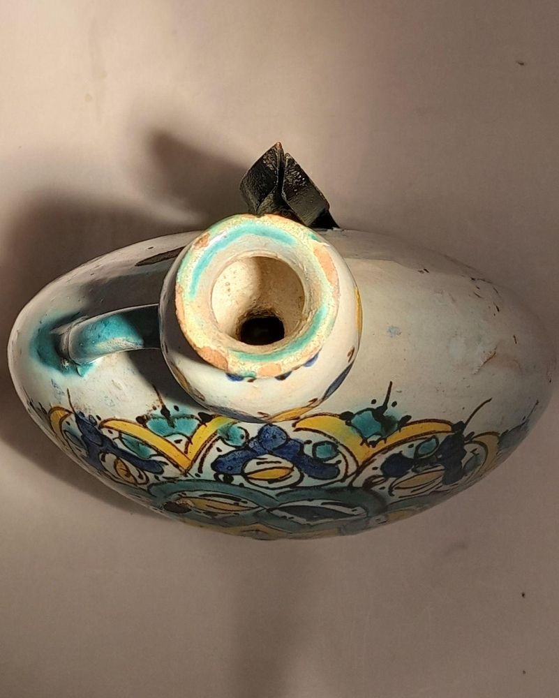 Moroccan tin glazed earthenware or faience pilgrim water flask antique 19th century hand painted with polychrome Arabesque foliate geometric pattern  727 grammes  9 inches long 6.5 inches wide  3 5/8 inches deep
