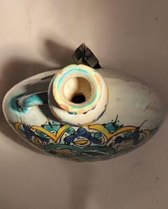 Moroccan tin glazed earthenware or faience pilgrim water flask antique 19th century hand painted with polychrome Arabesque foliate geometric pattern  727 grammes  9 inches long 6.5 inches wide  3 5/8 inches deep