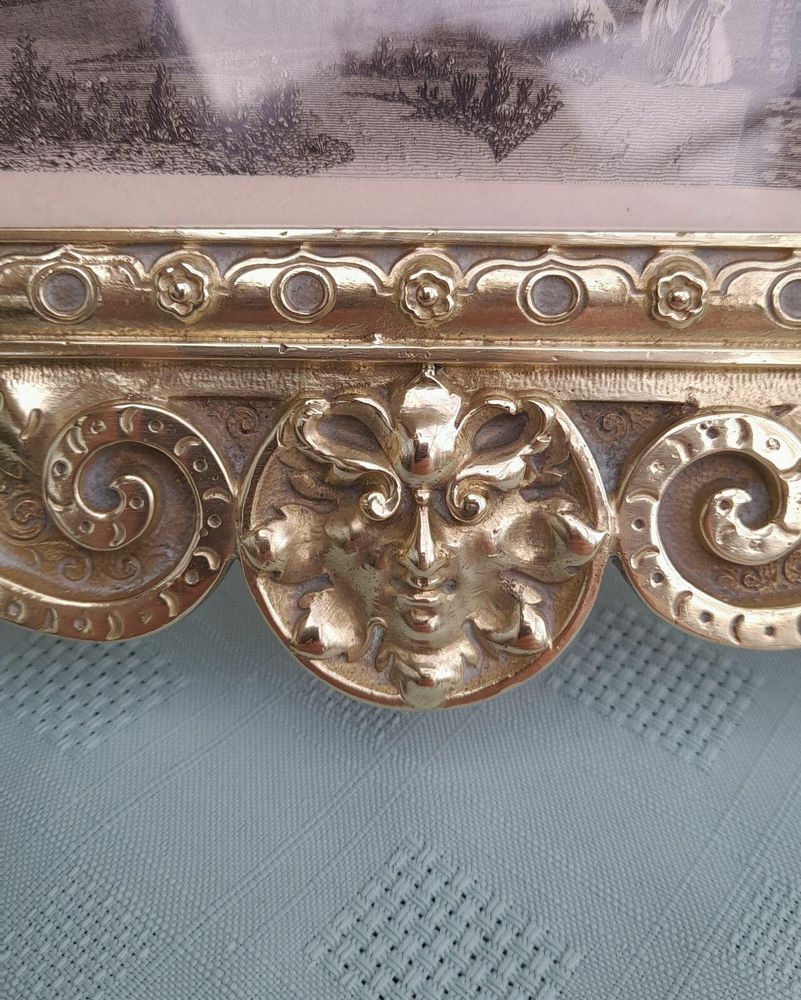 Antique Gothic Revival easel photo picture frame in high relief cast brass - decorated with helmeted leopards, the green man's head & ornate scrolls - for a landscape image size 6" x 4.5" - frame size 9" high, 10 inches wide by 8 inches deep, 19th century circa 1860. weighs 1156 grammes unpacked.
