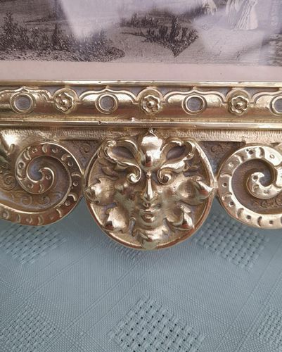 Antique Gothic Revival easel photo picture frame in high relief cast brass - decorated with helmeted leopards, the green man's head & ornate scrolls - for a landscape image size 6" x 4.5" - frame size 9" high, 10 inches wide by 8 inches deep, 19th century circa 1860. weighs 1156 grammes unpacked.