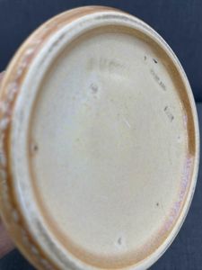 Angled base view showing the date mark for 1923