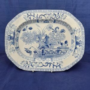Plate on a stand blue background