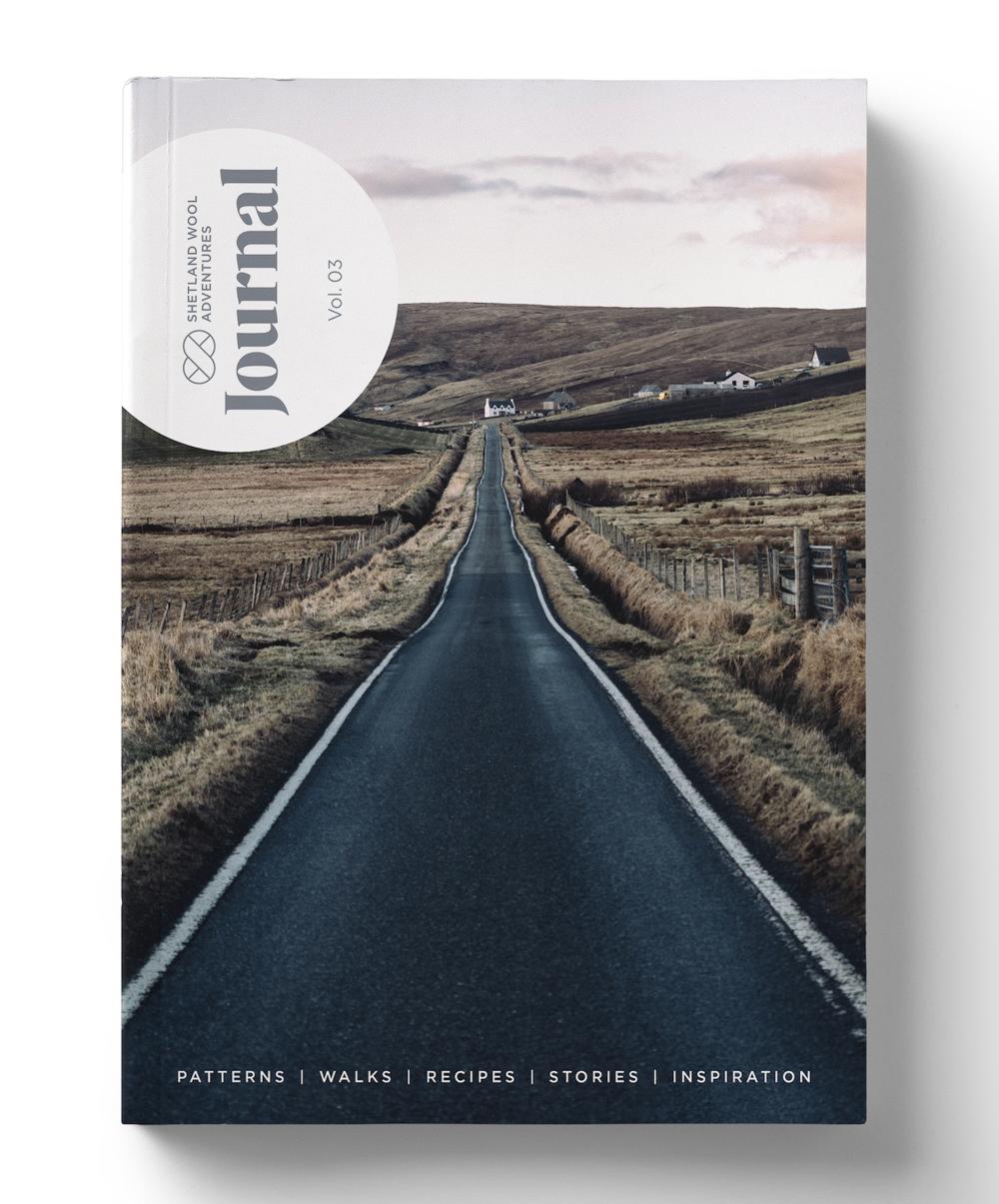 Shetland Wool Adventures Journal, volume 3, against a white shelf