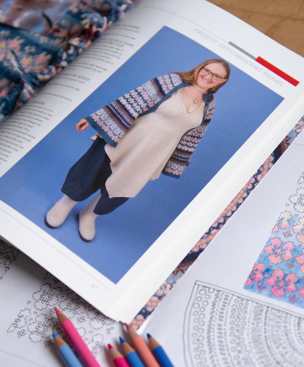KNITSONIK Stranded Colourwork Playbook open on a page featuring the Efflorescent shawl, cherry blossom edition