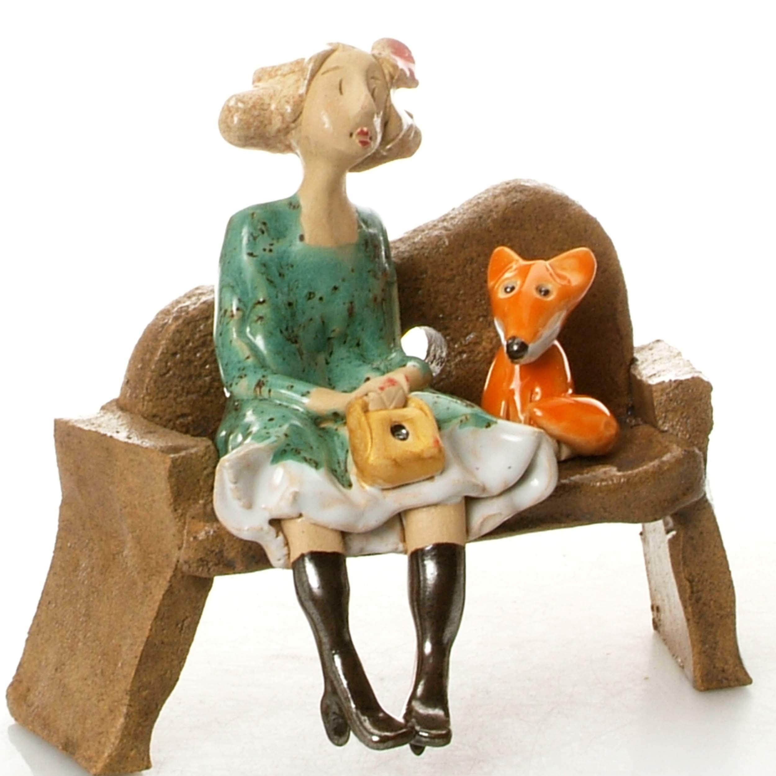 Ceramic Foxy Lady Figurine sitting on Bench with Fox