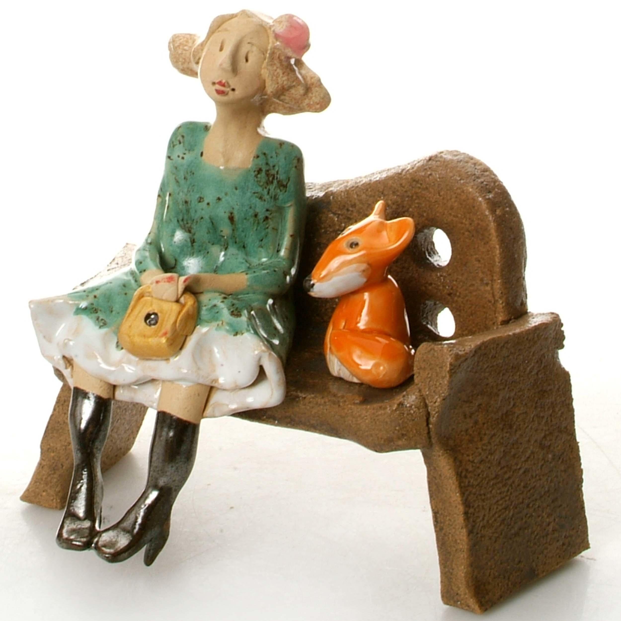 Ceramic Foxy Lady Figurine sitting on Bench with Fox