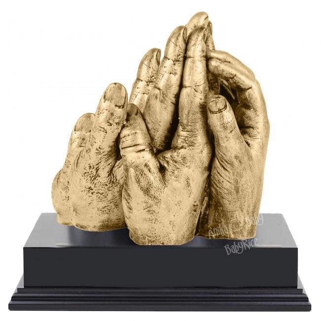 BabyRice Family Hand Cast with Metallic Brass Finish on Display Plinth